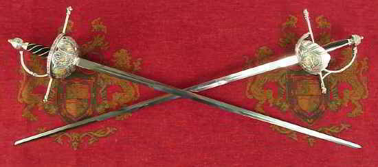 Renaisance rapier swords on tapestry background